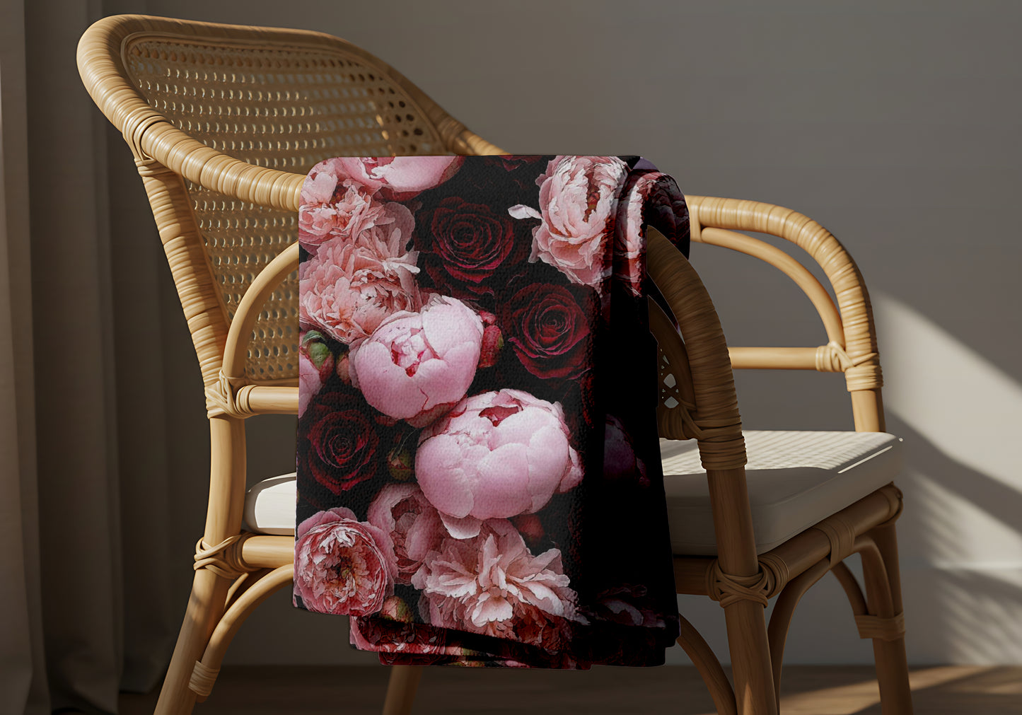 lightweight coral fleece floral blanket draped over chair