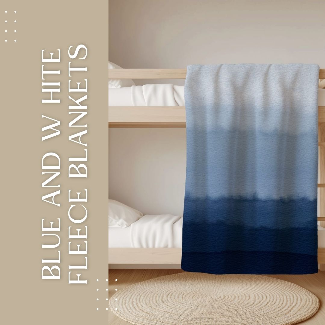 Blue and White fleece blanket with original South African design displayed on a bed.