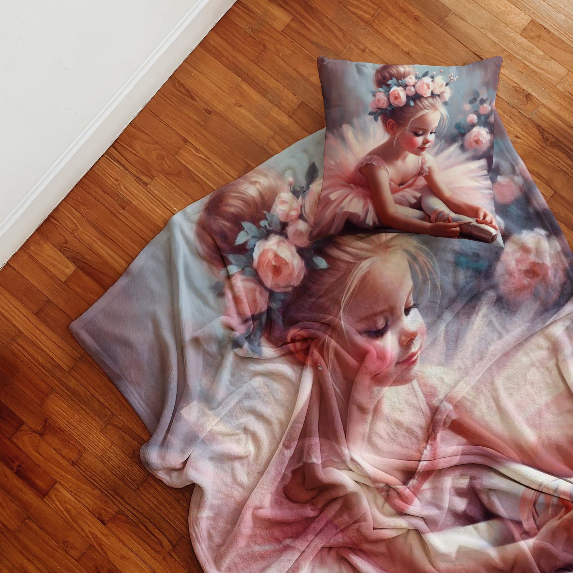 Girls ballerina fleece blanket with pink ballet artwork and floral details, styled on a white bed for a soft bedroom look.