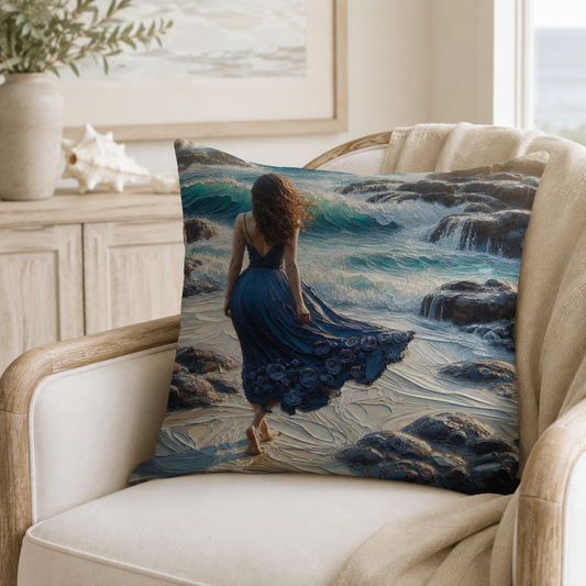 Coastal inspired cotton scatter cushion on a cream chair featuring exclusive Lily Grace Design ocean artwork in blue tones.