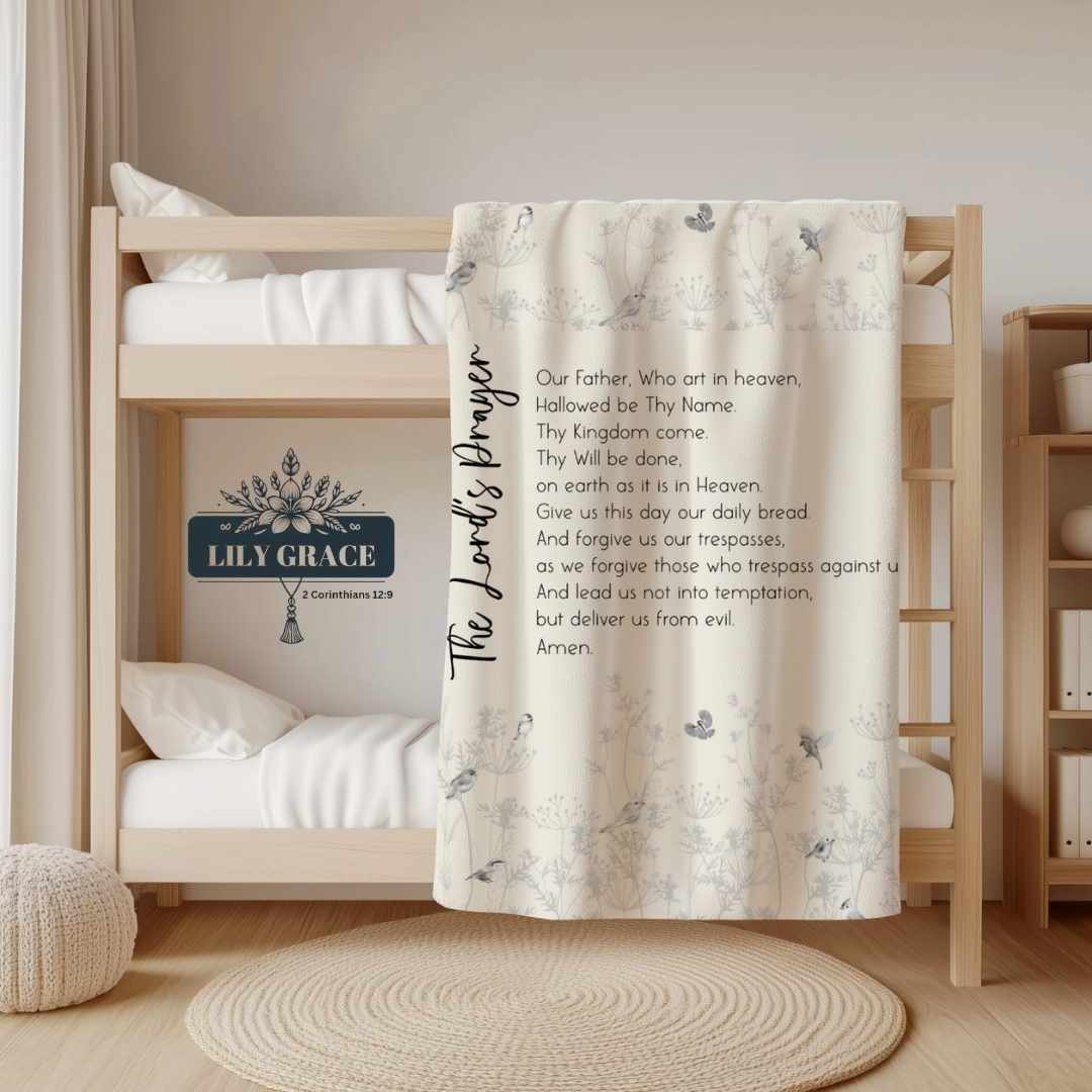 The Lord’s Prayer Faith Blanket with elegant script text and floral accents.