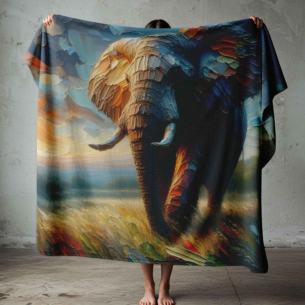 Colourful elephant print fleece blanket on a double bed, featuring teal, blue and gold wildlife artwork by Lily Grace Design.