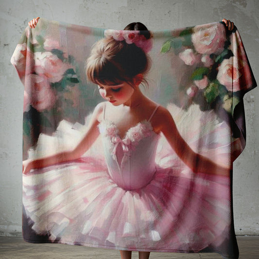 Petite Ballerina lightweight fleece blanket on a white bed with soft pink ballet girl artwork and floral details.