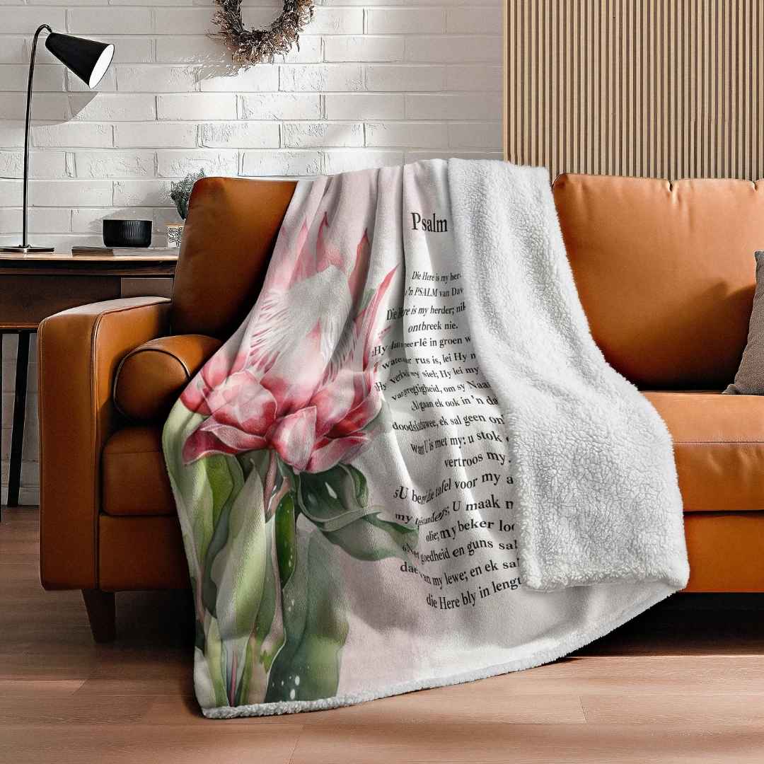 Afrikaans Psalm 23 fleece blanket with pink protea design and soft white sheep’s fleece backing