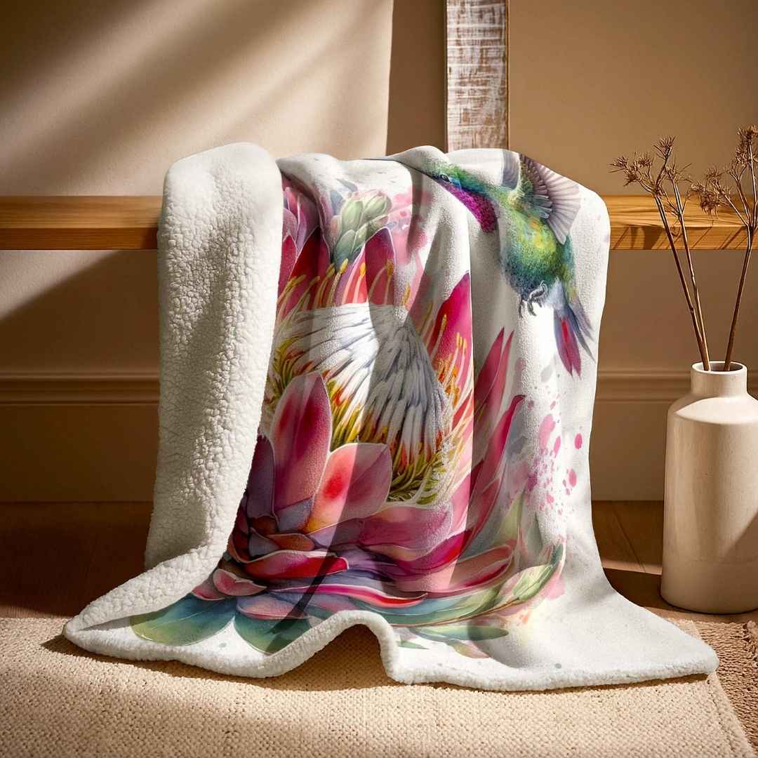Protea floral sheep fleece blanket with vibrant pink artwork, styled in a calm neutral home interior