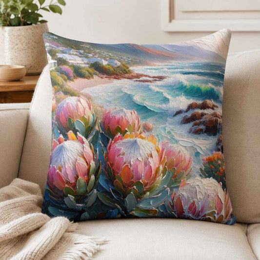 Coastal Protea cotton scatter cushion cover with pink proteas and ocean artwork in a neutral South African living room