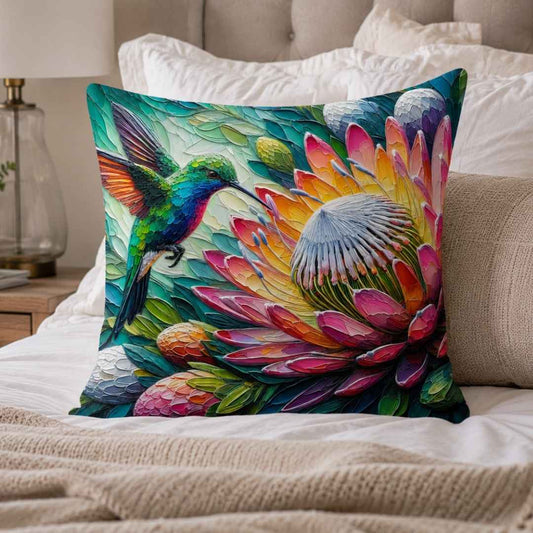 Close-up of Lily Grace Design hummingbird protea cotton cushion with vivid pink, teal, green and orange detail