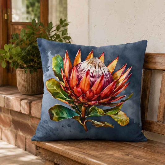 King Protea velvet scatter cushion cover styled on a wooden bench in a South African home