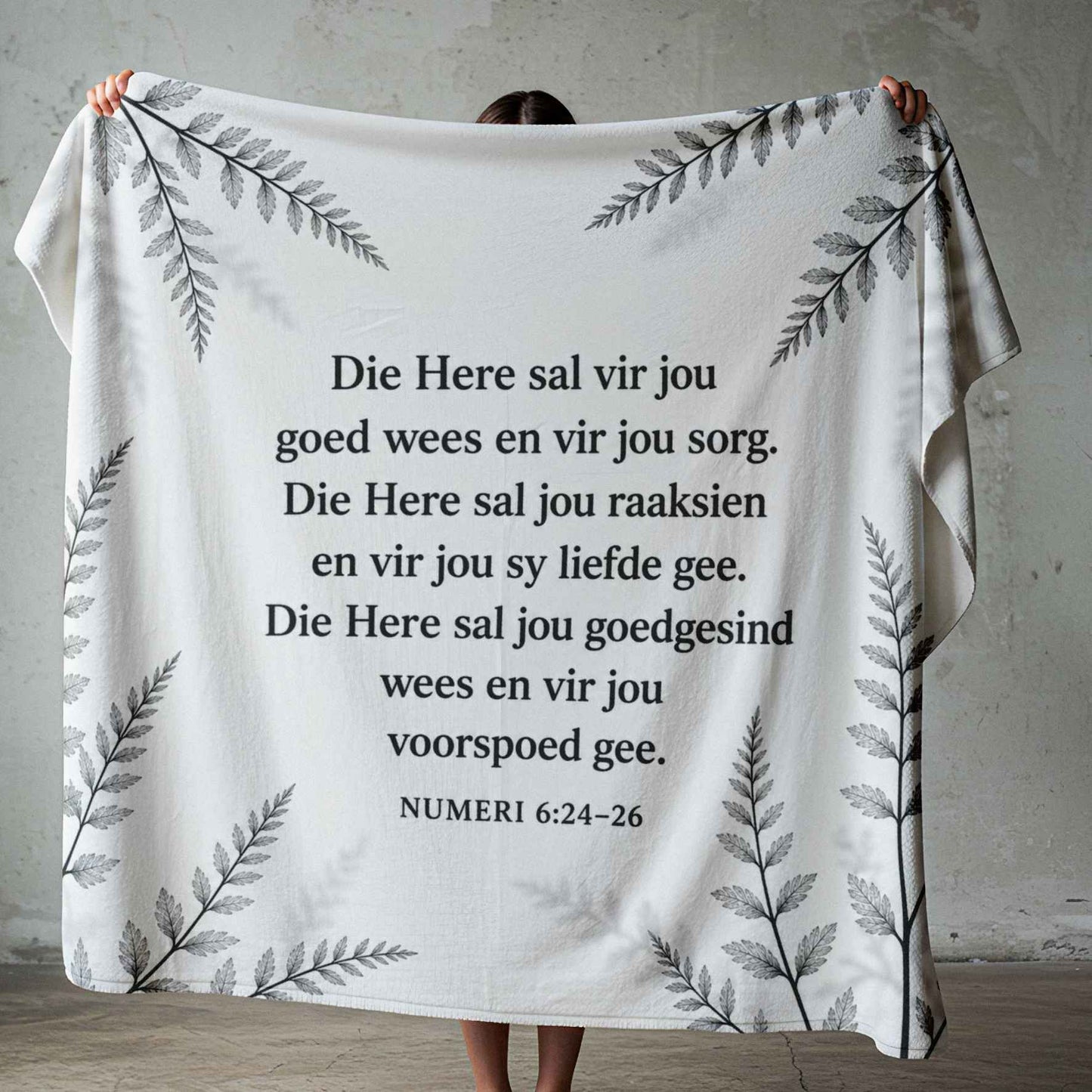 Square black-and-white botanical fleece blanket design featuring the Afrikaans Numeri 6:24–26 blessing in clear black text.
