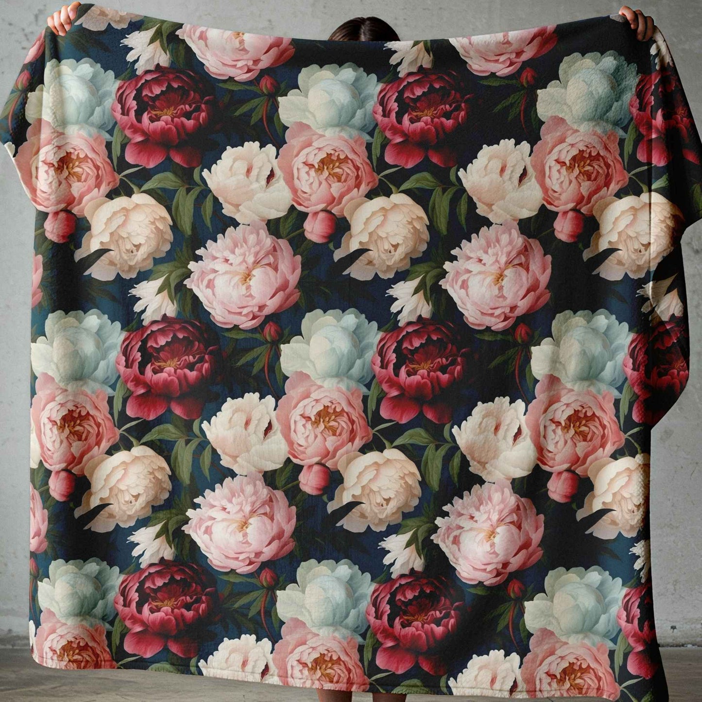 Lightweight fleece blanket with pink and cream floral design on a dark background, printed in South Africa.
