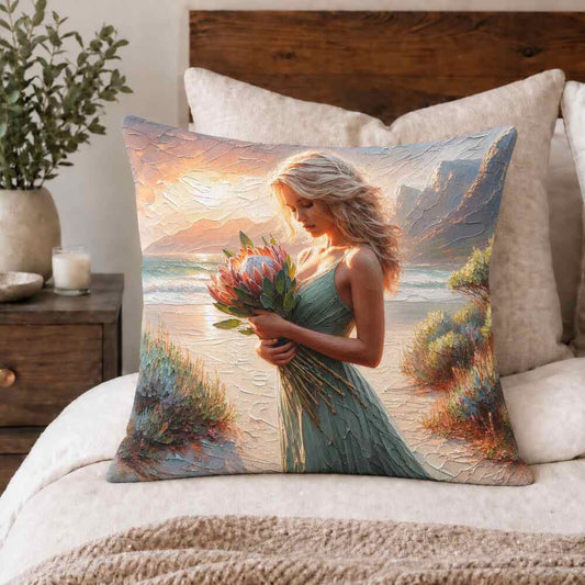 Coastal protea woman scatter cushion displayed on a neutral bed by Lily Grace Design South Africa.